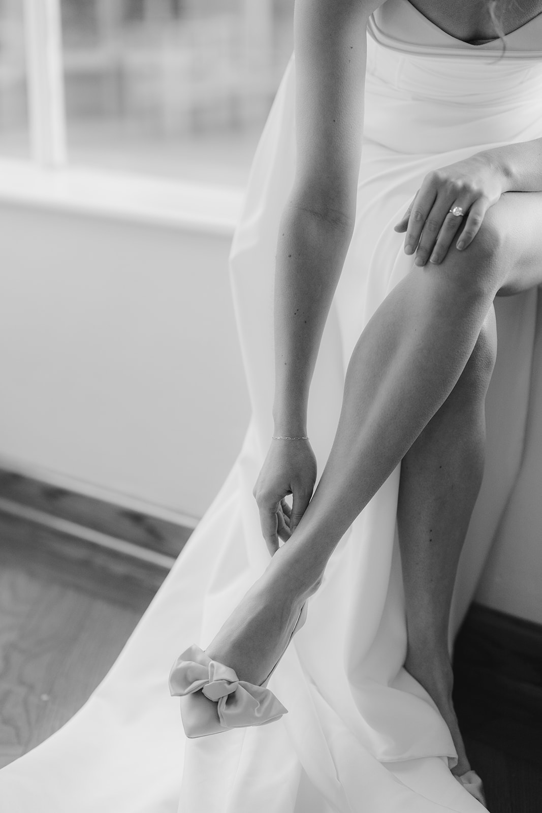 Bride getting ready with her wedding shoes at Hollins House in Santa Cruz, California.