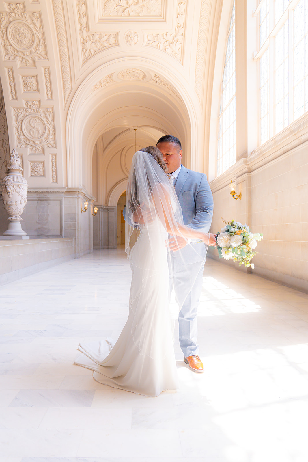 Bride and groom dancing together during their wedding at San Francisco City Hall.