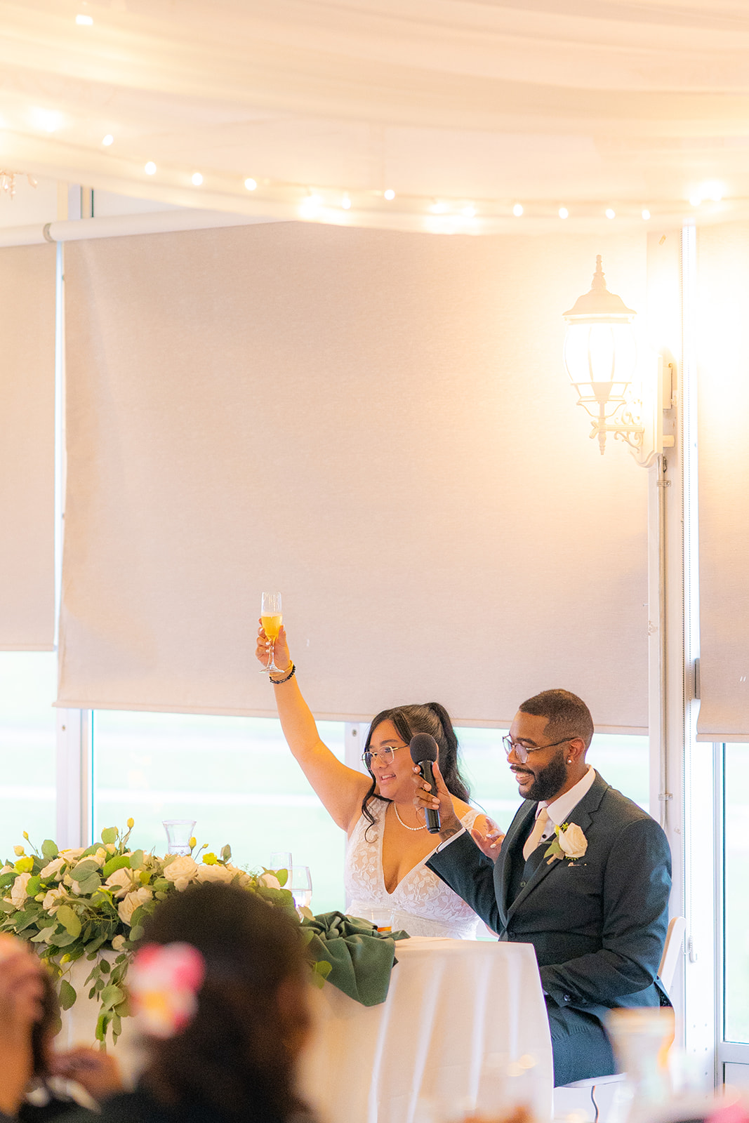 Bride and groom sharing a wedding toast at Fairview Metropolitan in Oakland, California.