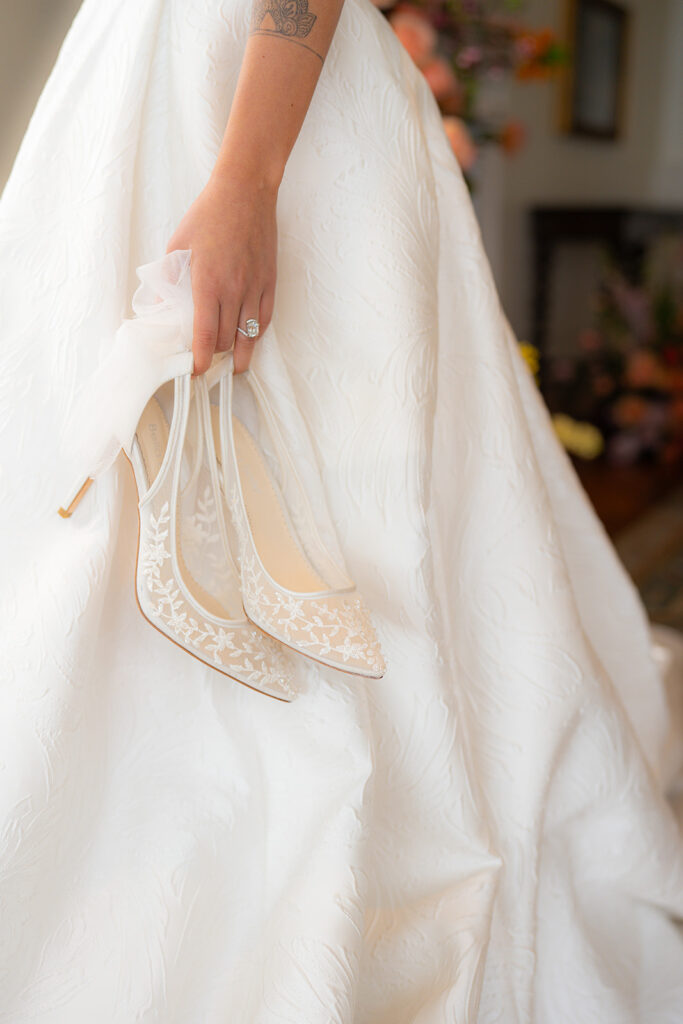 Bride carrying her wedding shoes at Hollins House in Santa Cruz, California.