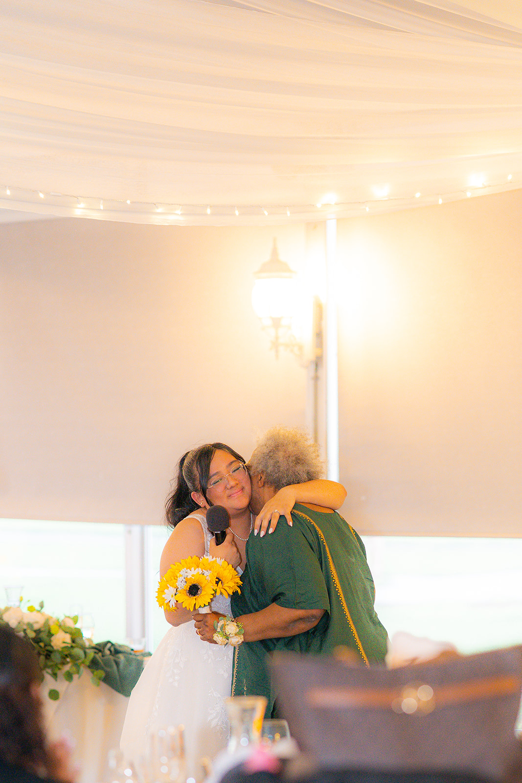 Bride hugging the groom’s mother during a wedding at Fairview Metropolitan in Oakland, California.