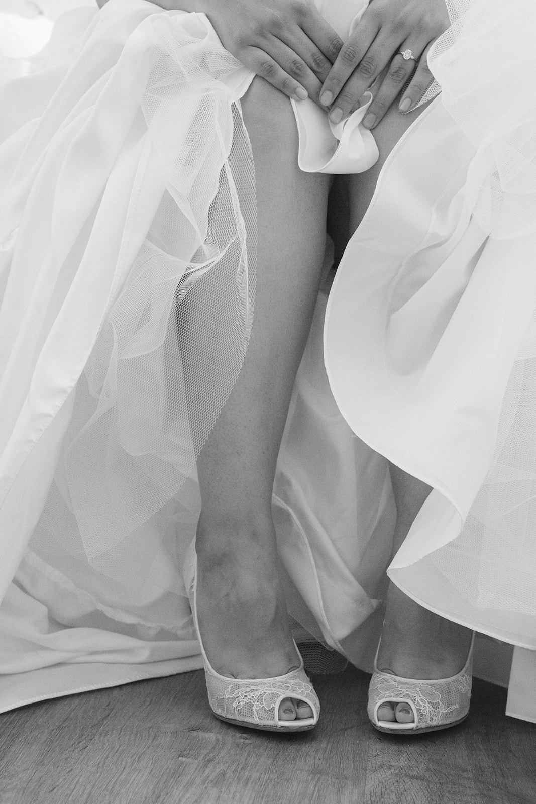Bridal photograph highlighting the bride’s shoes and wedding dress at Olive Hill Estate in Byron, California.