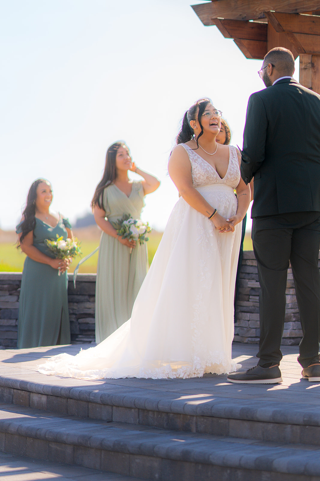 Bride smiling during her wedding ceremony at Fairview Metropolitan in Oakland, California.