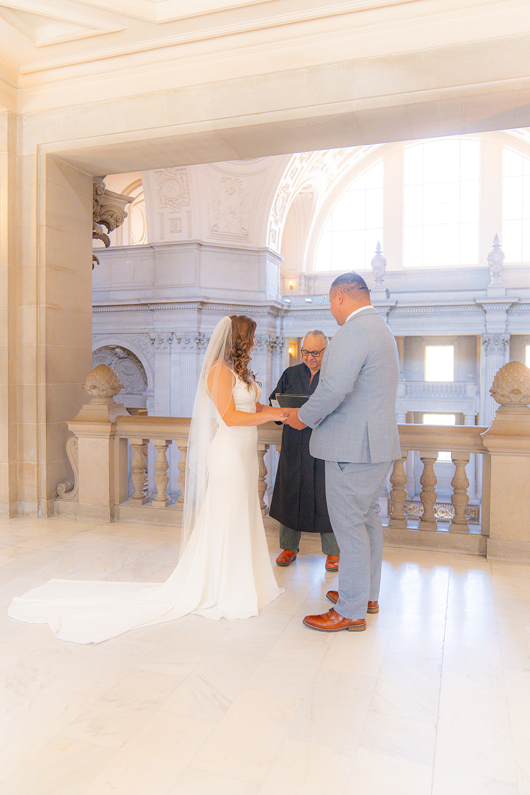 Wedding ceremony taking place inside San Francisco City Hall in California.