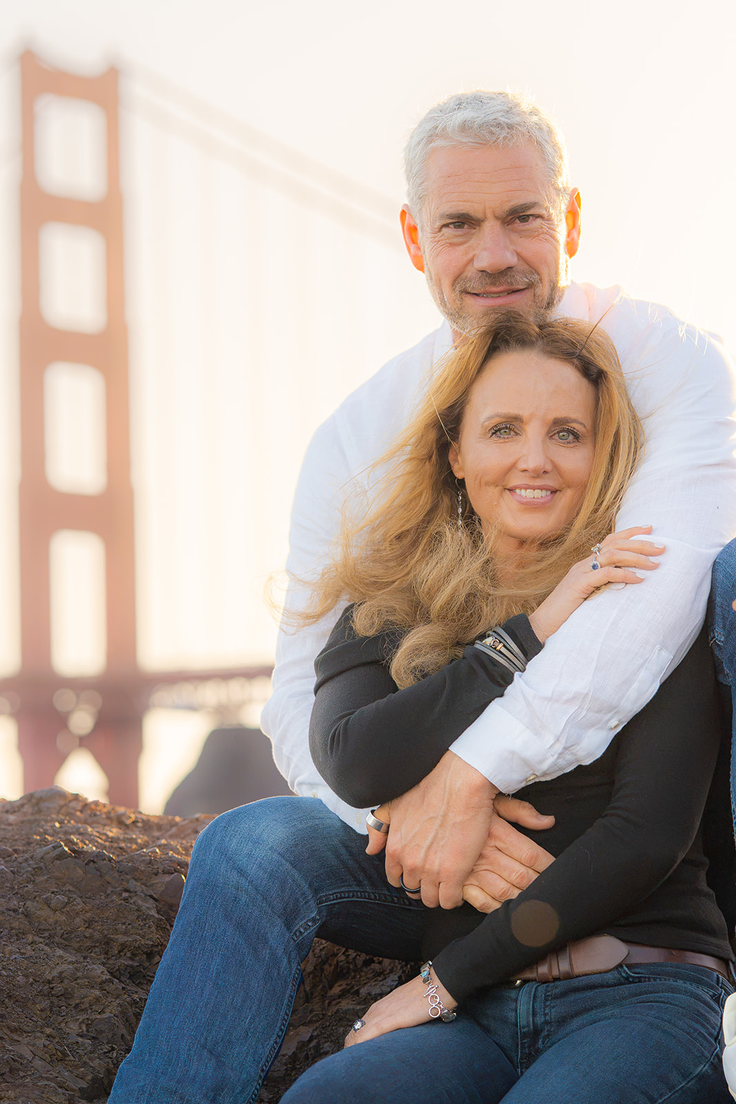 Dreamy couple at sunset at Cavallo Point with the Golden Gate Bridge and San Francisco Bay in the background