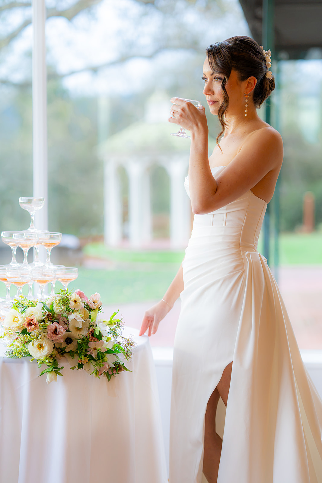 Bride drinking champagne during an editorial bridal session at Hollins House in Santa Cruz, California.