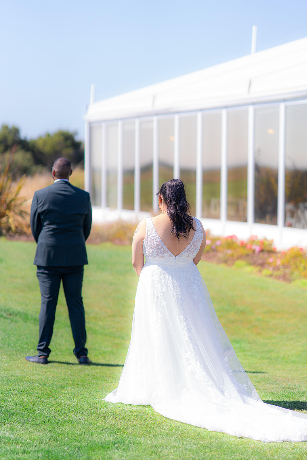 Bride and groom sharing their first look on the golf course at Fairview Metropolitan in Oakland, California.