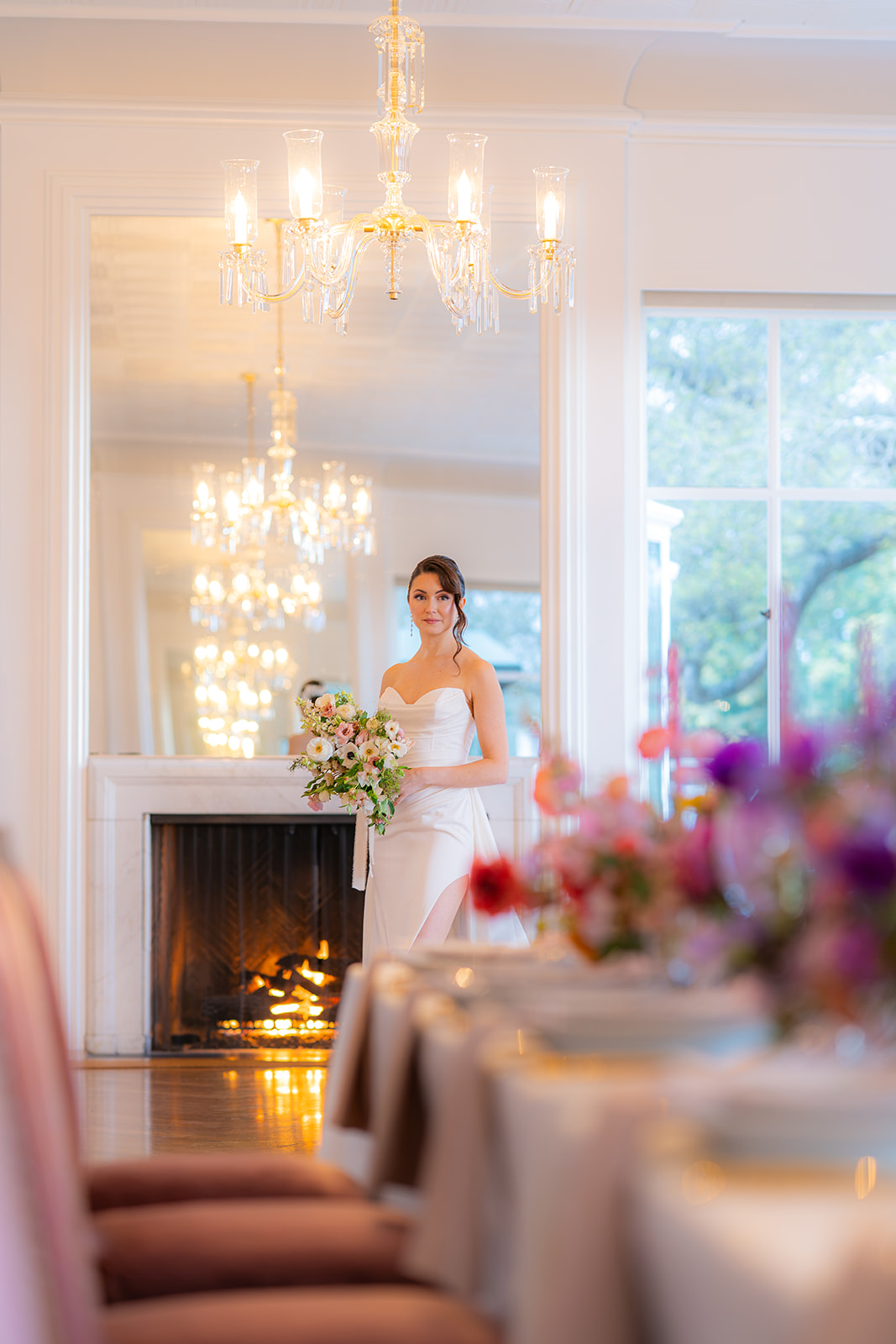 Bride posing beside an elegantly styled wedding tablescape at Hollins House in Santa Cruz, California.
