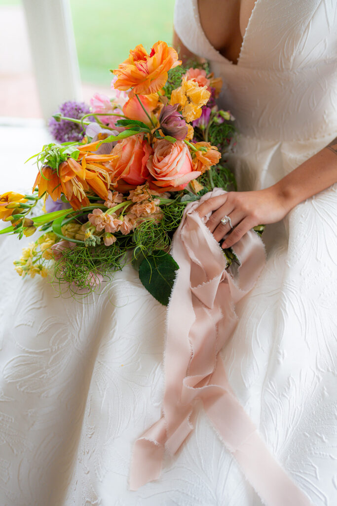 Bride holding her wedding bouquet at Hollins House in Santa Cruz, California.