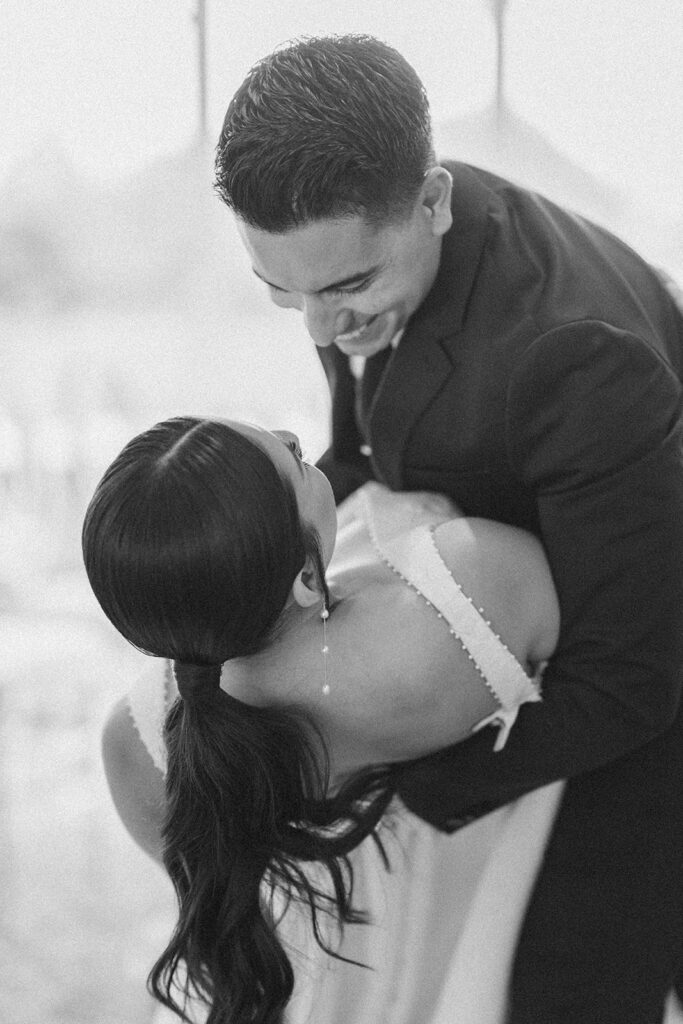 Groom dipping the bride during a dance at Hollins House in Santa Cruz, California.