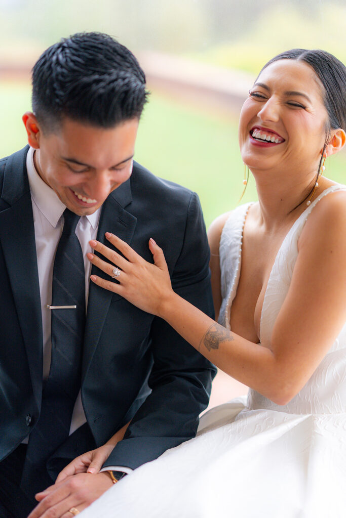 Bride and groom laughing together at Hollins House in Santa Cruz, California.