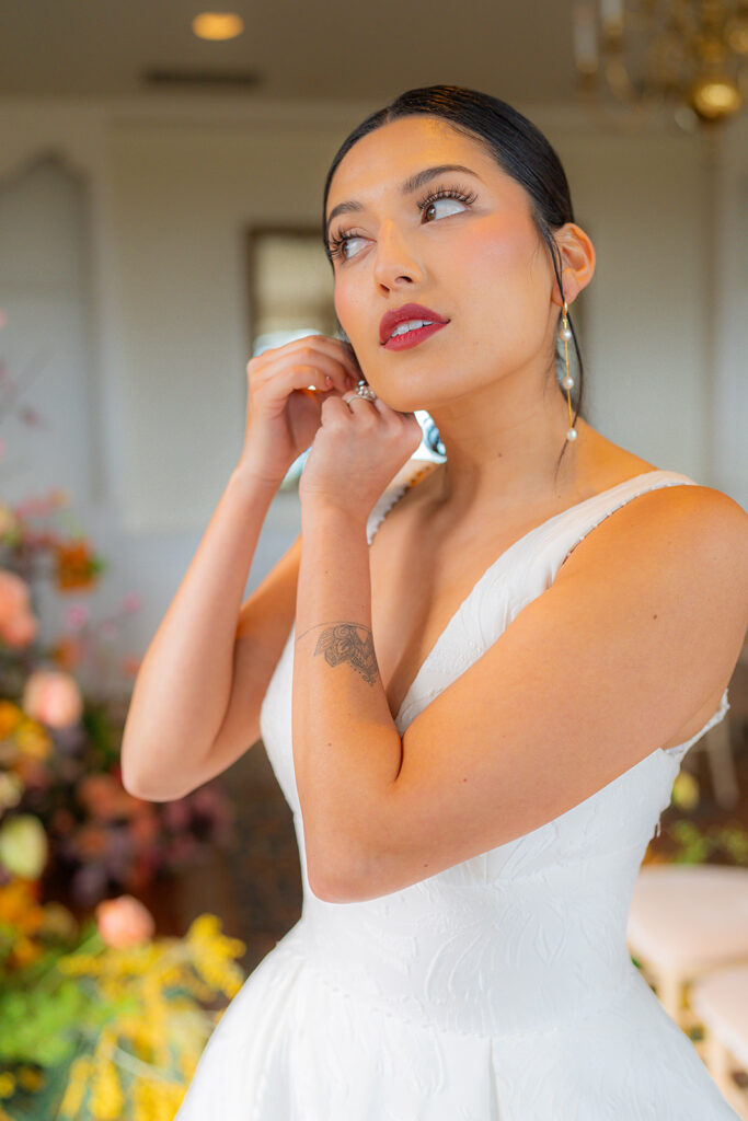 Bride getting ready for her wedding at Hollins House in Santa Cruz, California.
