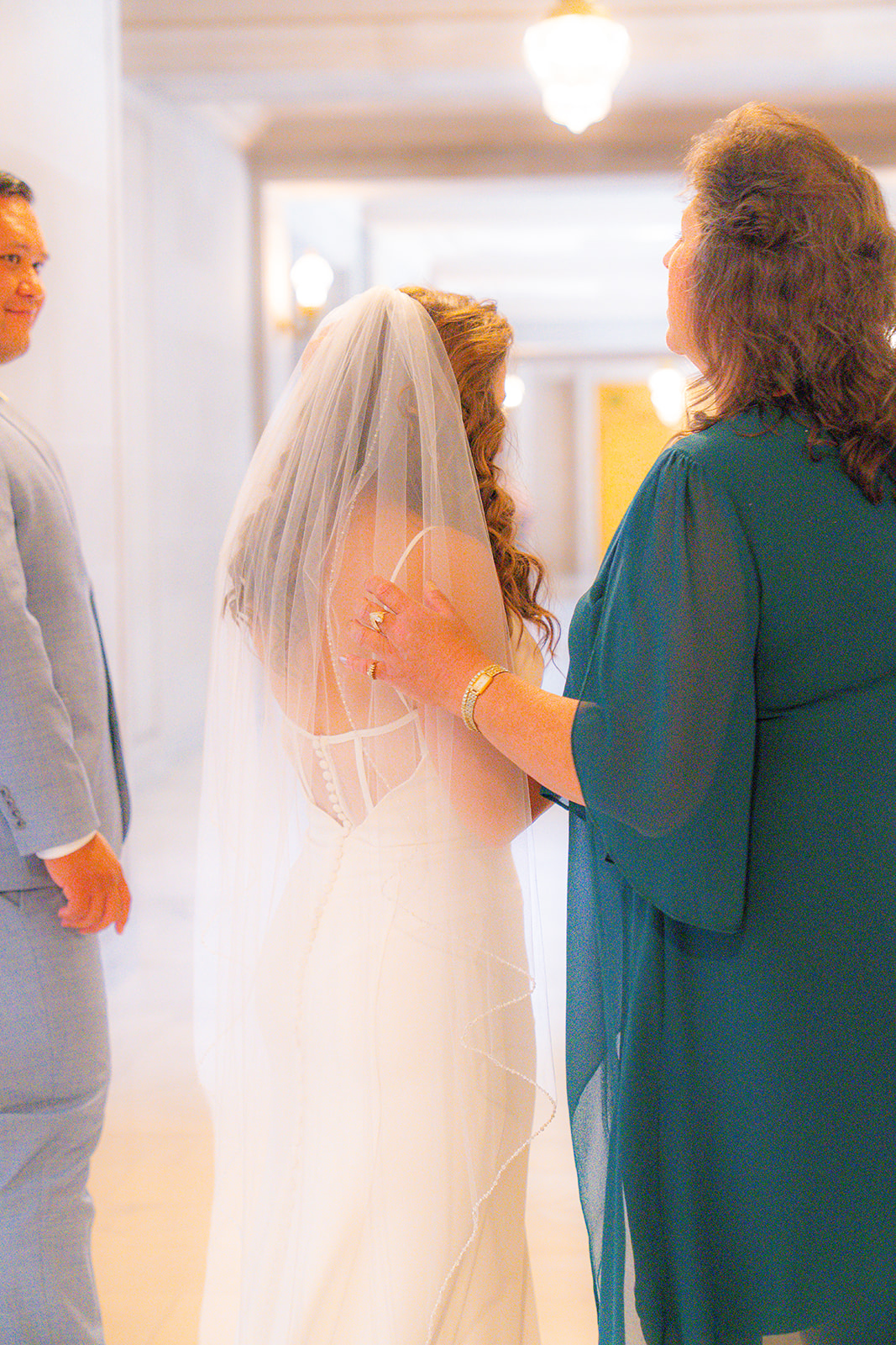 Bride sharing a moment with her mother before the wedding ceremony at San Francisco City Hall.