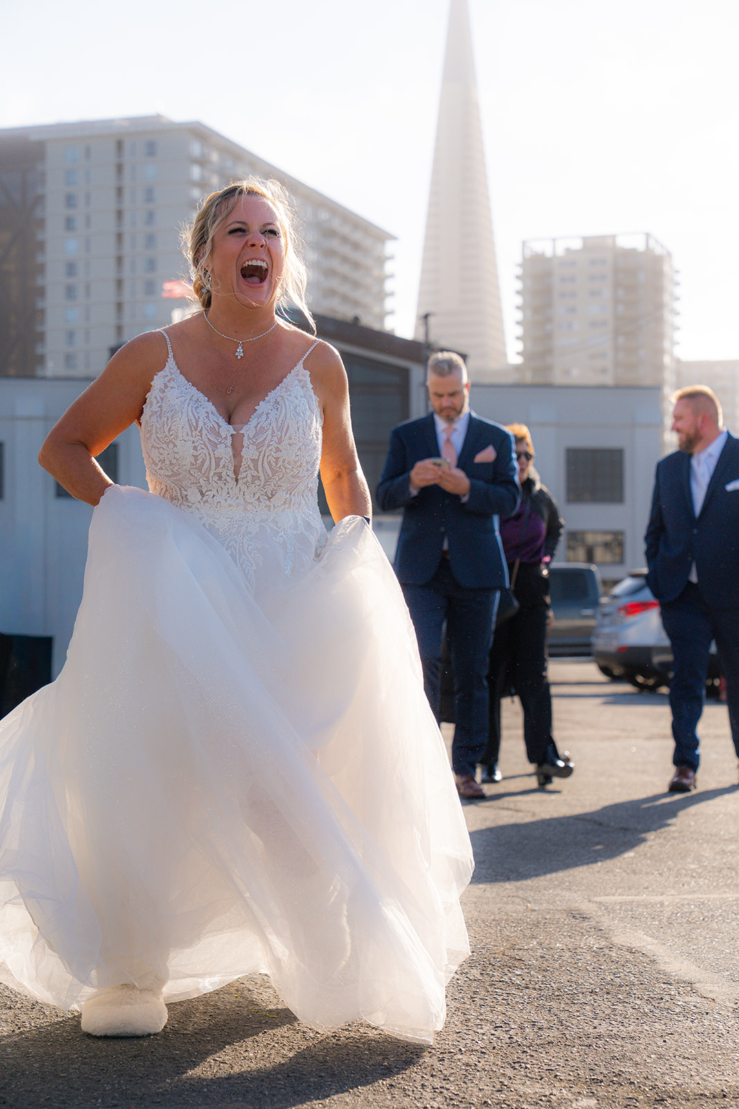 Bride boarding a boat for her wedding reception on the San Francisco Bay
