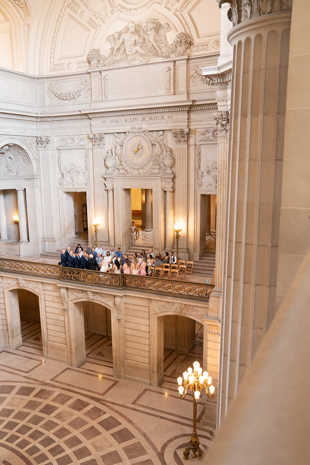 Balcony view inside San Francisco City Hall during a wedding celebration