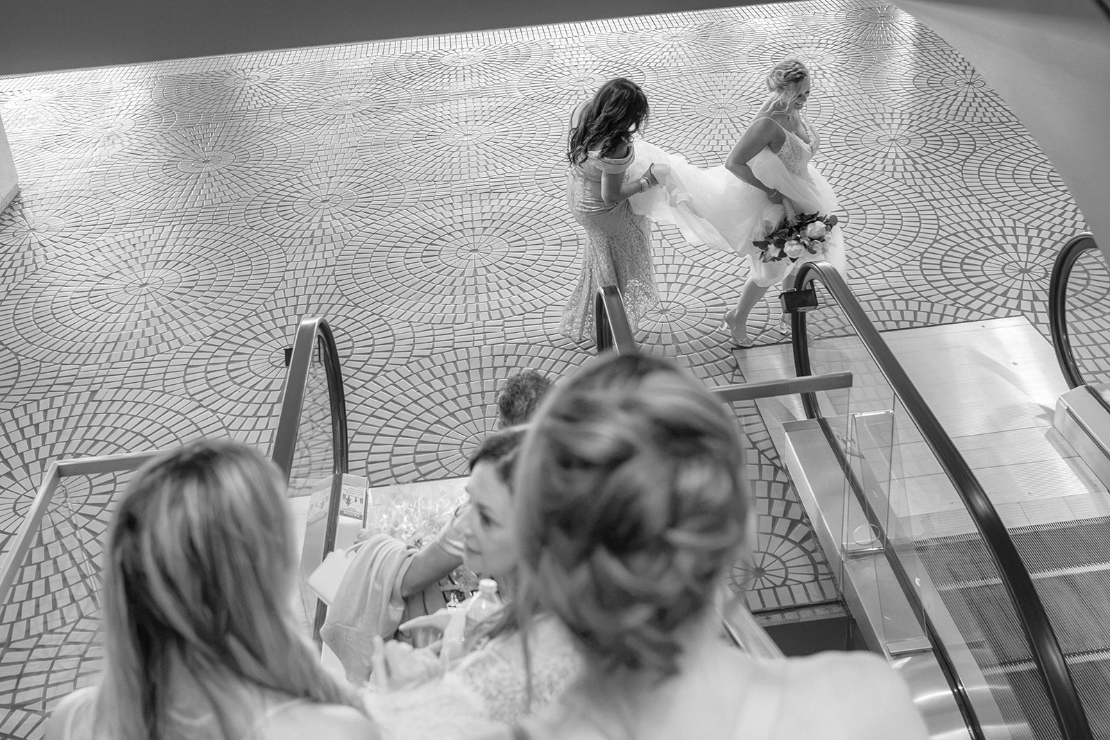 Bride and bridesmaids leaving their hotel together before a San Francisco wedding ceremony