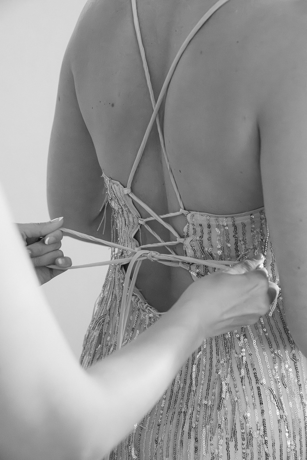 Black and white photo of bridesmaids in champagne dresses getting ready for a San Francisco wedding ceremony