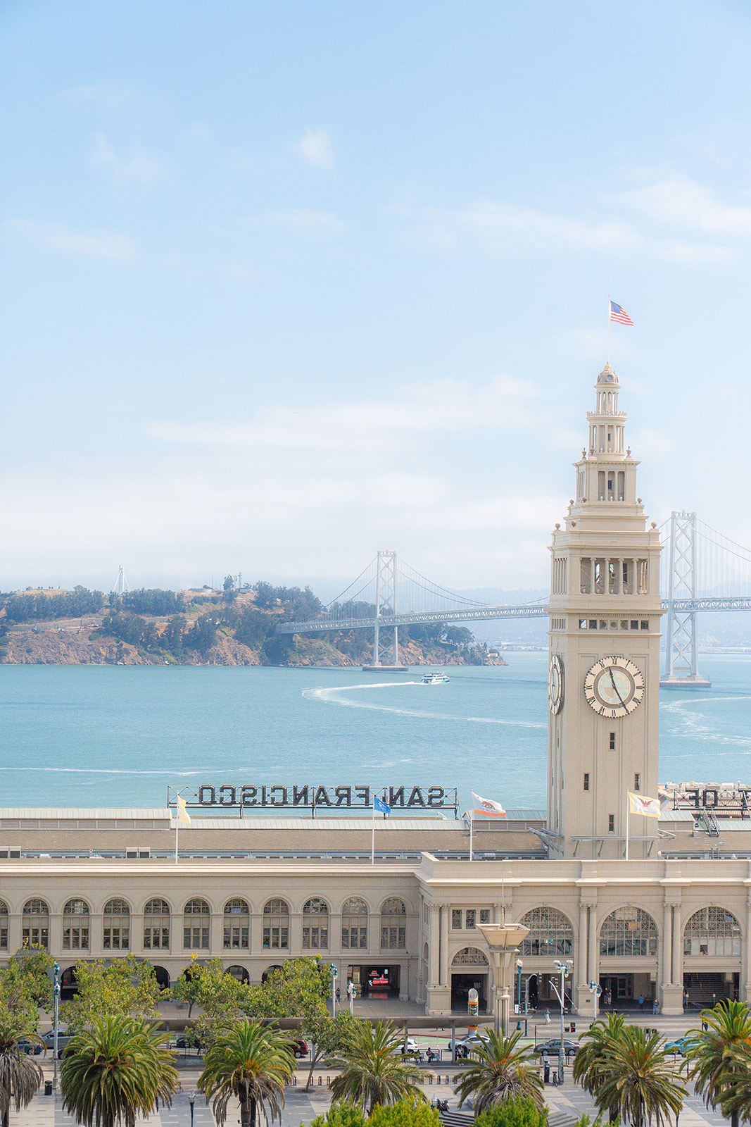 View of the San Francisco Ferry Building from a hotel balcony during wedding day preparations