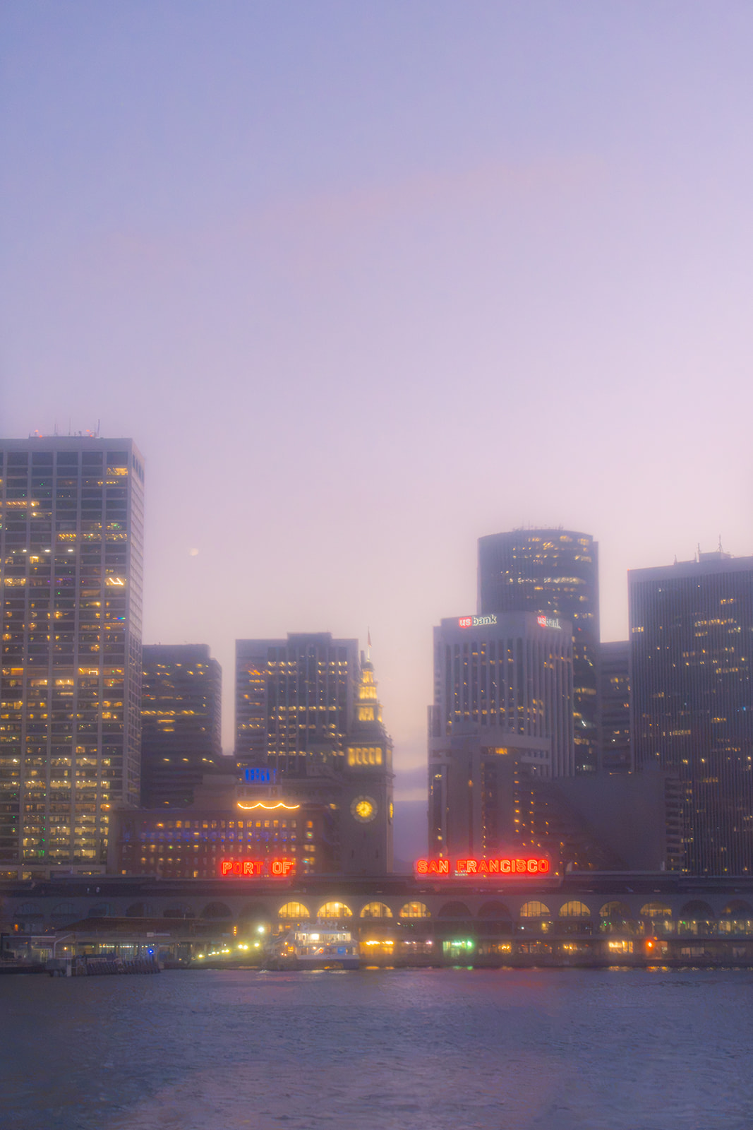 San Francisco city view through a window during a wedding boat reception on the bay