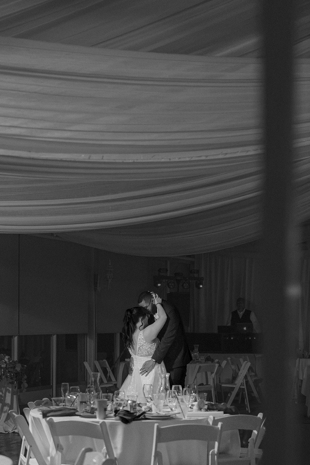 Black-and-white photograph of a bride and groom sharing a private last dance at Fairview Metropolitan in Oakland, California.