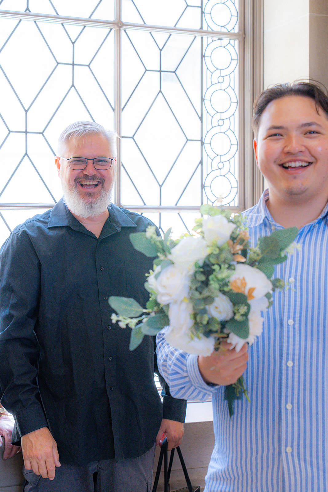 Wedding guests celebrating together at San Francisco City Hall in California.